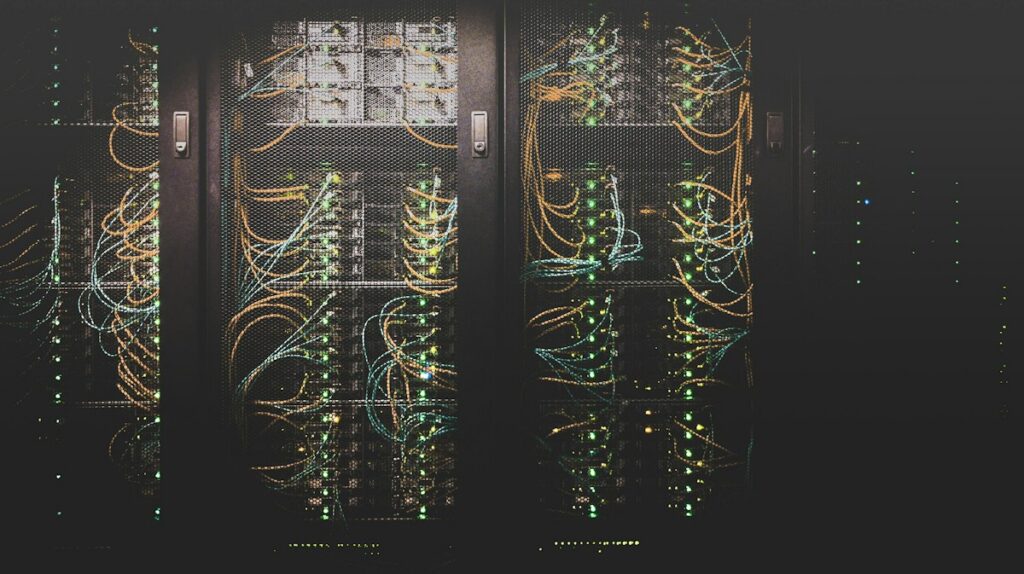 Rows of servers in a data center facing cooling pressure from data center heat waves