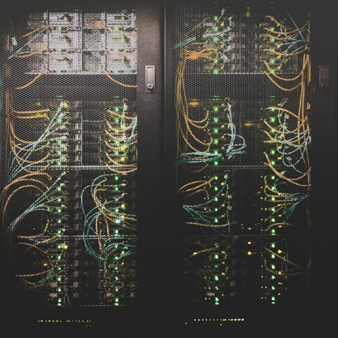 Rows of servers in a data center facing cooling pressure from data center heat waves