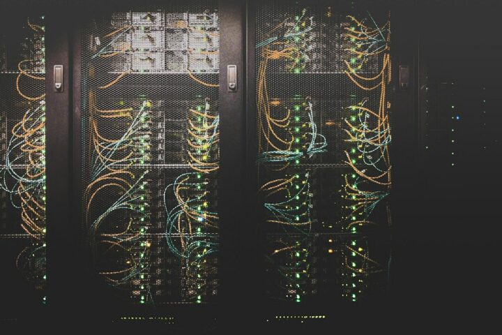 Rows of servers in a data center facing cooling pressure from data center heat waves